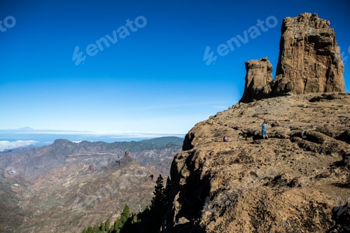 Preview: Adventurers standing on a mountain overlook with majestic views