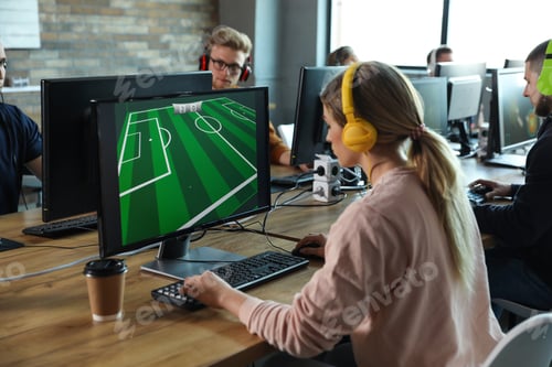 Preview: Woman playing video game in internet cafe