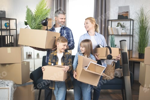 Preview: Happy Caucasian family with kids standing with boxes at new apartment