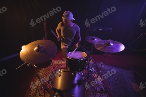 Preview: Male drummer performing in nightclub