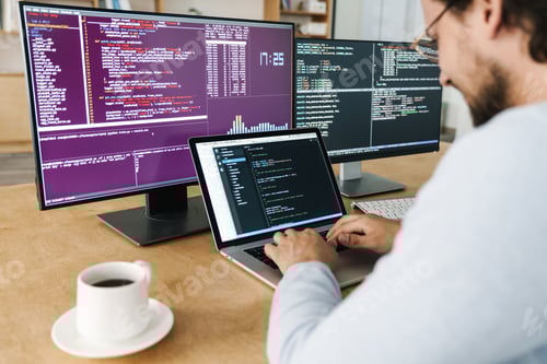 Preview: Cropped image of man typing on keyboard while working with computers