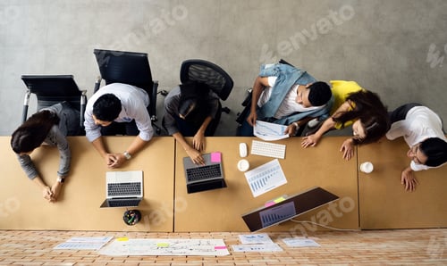 Preview: Asian business people team meeting in modern office working design planning and ideas