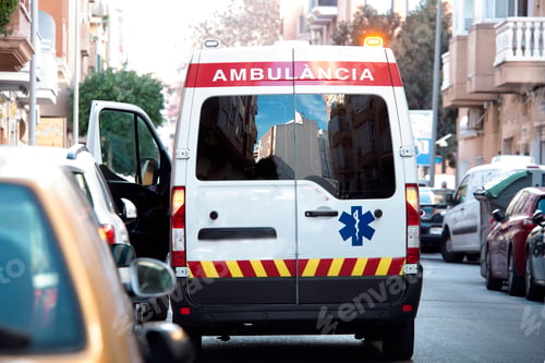 Preview: Ambulance parked on city street with open door
