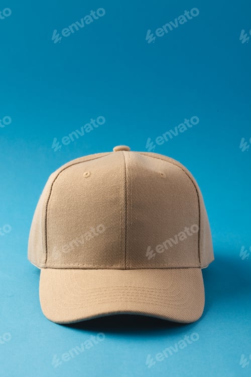 Preview: Cream baseball cap and copy space on blue background