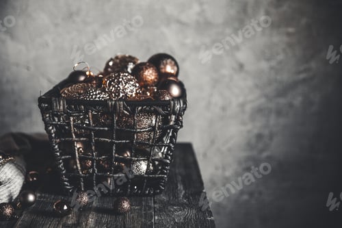 Preview: vintage christmas, new Year toys and decoration in basket on brown wooden table, copy space