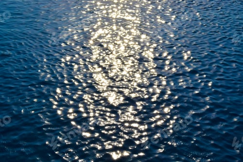 Preview: Blue water ripples in the swimming pool.