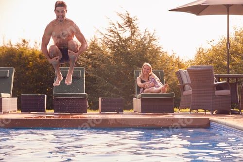 Preview: Father Jumps Into Outdoor Pool On Summer Vacation Watched By Mother And Son