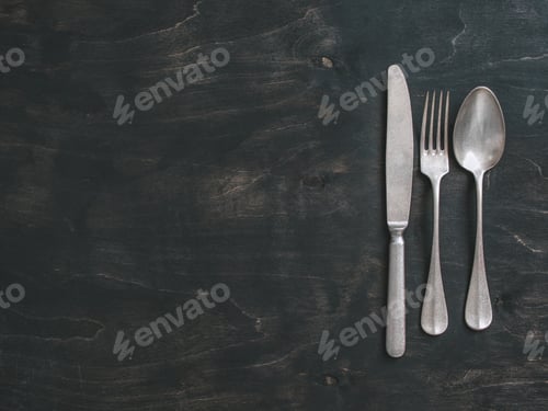 Preview: Vintage cutlery on dark background, copy space