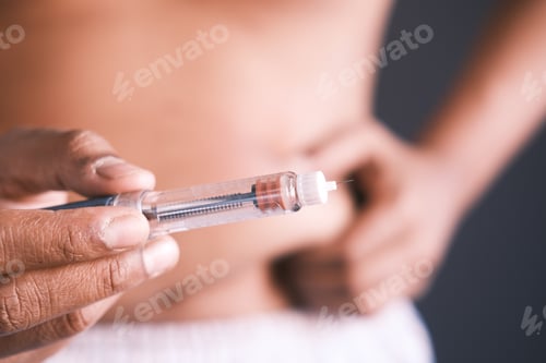 Preview: young man hand using insulin pen close up