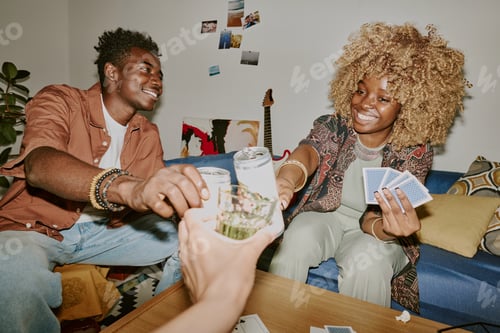 Preview: Friends Toasting during Card Game