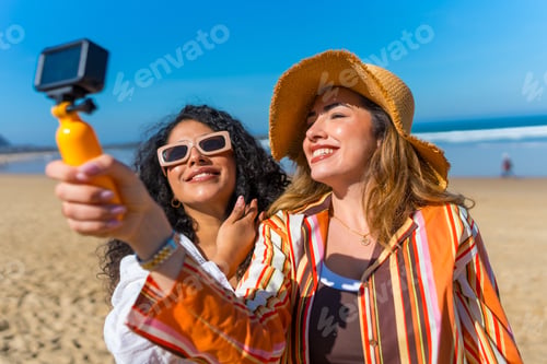 Preview: Happy women friends recording selfie video on summer beach vacation