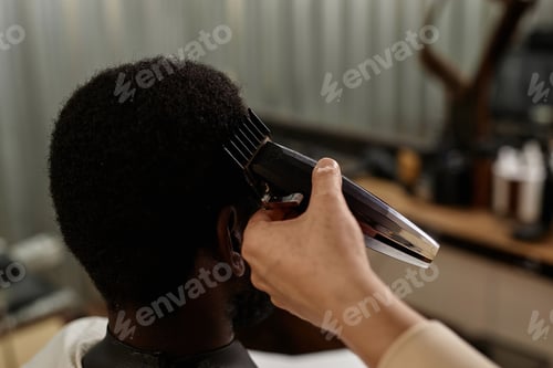 Preview: Barber using trimmer to cut hair
