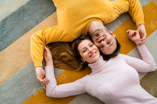 Preview: Happy couple in love hugging and enjoying time together at home