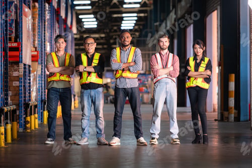 Preview: Portrait of group employees in the warehouse with arms crossed