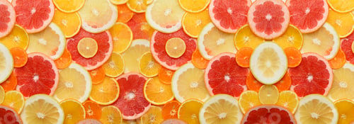 Preview: Citrus fruits cut into round pieces: orange, grapefruit, lemon, tangerine. Ripe and juicy fruits
