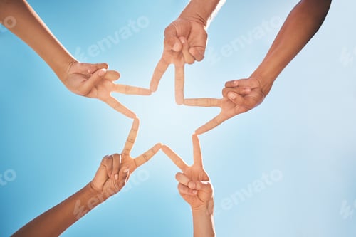 Preview: Hands, star and teamwork with friends in a huddle on a clear blue sky background from below. Trust,