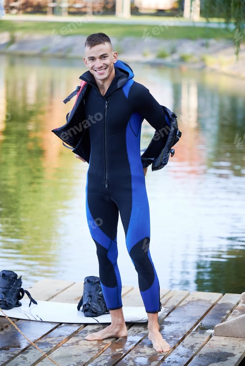 Preview: Young surfer having fun wakeboarding in the cable park.