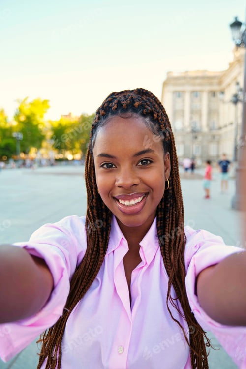 Preview: Cuban young woman doing a selfie in Madrid, Spain.