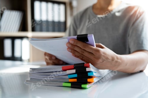 Preview: Asian businesswoman searching for documents about orders, goods, exports business information detail