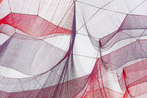 Preview: Red and purple nets under the ski. Textured background. Horizontal