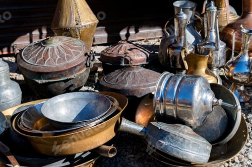 Preview: Close up of antique brass jugs and dishes