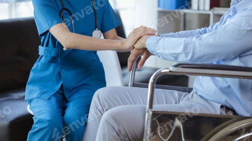 Preview: Doctor touches the arm to encourage the patient in the hospital examination room.