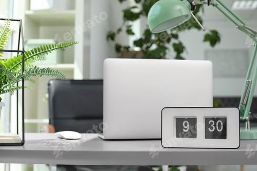 Preview: Alarm clock on table in office. Time to work