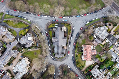 Preview: Aerial view directly above a church at the centre of a local community