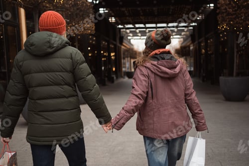 Preview: Couple in love shopping together at winter holidays