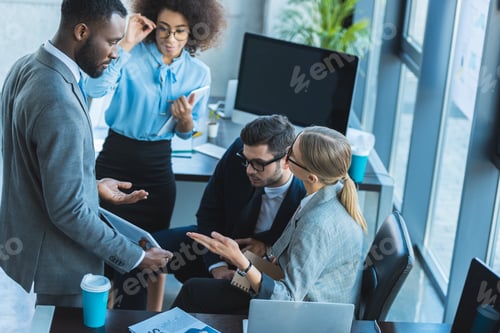 Preview: multicultural businesspeople having conversation in office