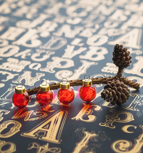 Preview: Christmas red decor ball and Pine cone on golden color type pattern table