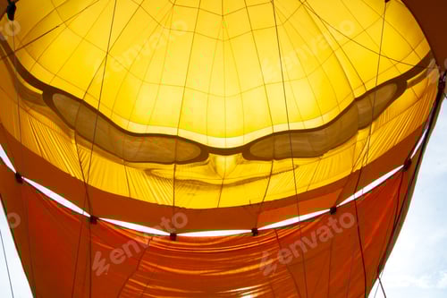 Preview: Inside a vibrant hot air balloon before inflation, showcasing colorful fabric patterns