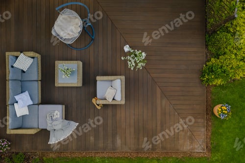 Preview: Top view of wooden terrace with comfortable wicker garden furniture