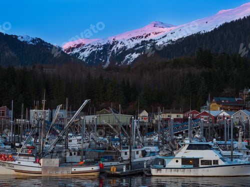 Preview: Ketchikan Alaska harbor with lots of fishing boats and mountains.