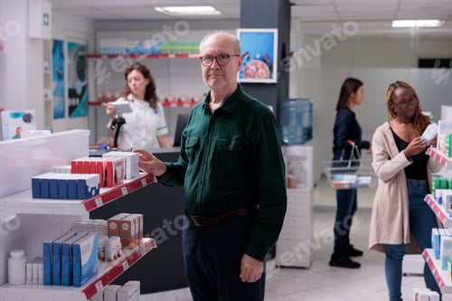 Preview: Portrait of elderly customer doing medicinal shopping