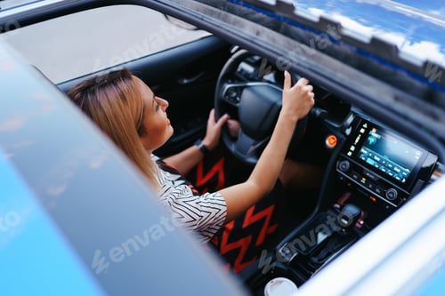 Preview: View of a driving woman through sunroof