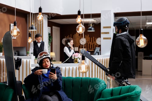 Preview: Travelers arrive and wait in hotel lobby