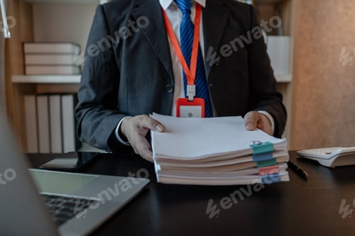 Preview: an accounting and financial officer is working on documents in the office