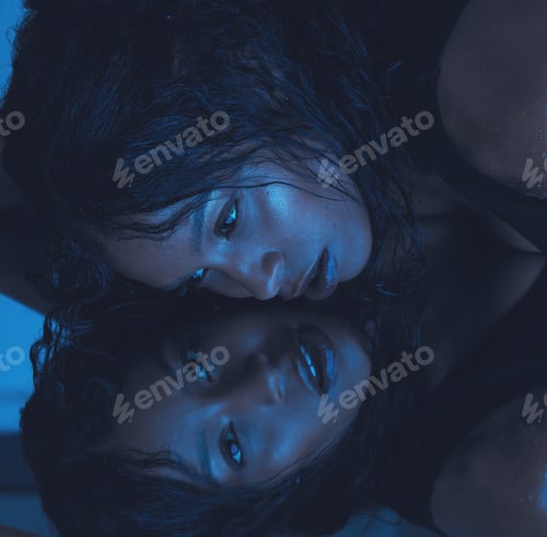 Preview: Art, dark reflection and woman in mirror, beautiful face of model girl lying and thinking on reflec