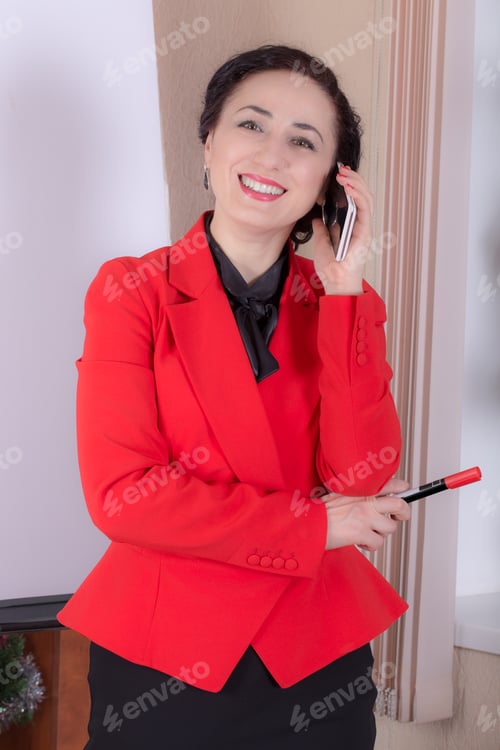 Preview: Business woman talking on the phone.