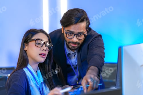 Preview: Senior engineer mentoring a junior female developer.