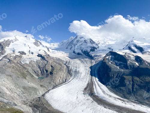 Preview: A glacier and snow covered mountain tops in the Swiss Alps