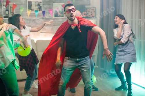 Preview: Handsome man in red superhero costume