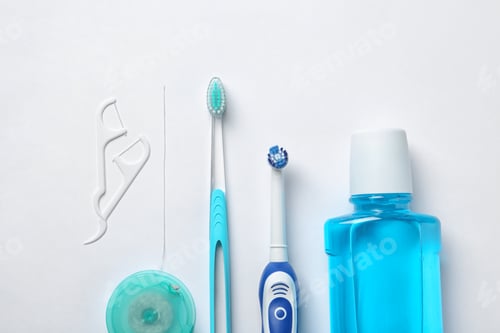 Preview: Flat lay composition with toothbrushes and oral hygiene products on white background