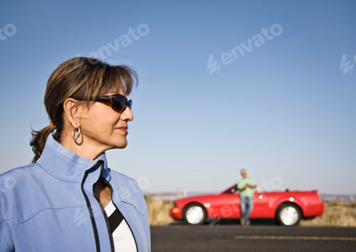 Preview: A portrait of a hip senior Hispanic woman on a road trip with her husband.