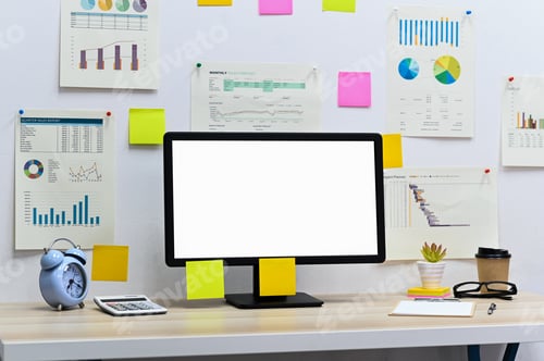 Preview: Computer blank screen with blank clip board, clock and calculator with office supplies on the desk.