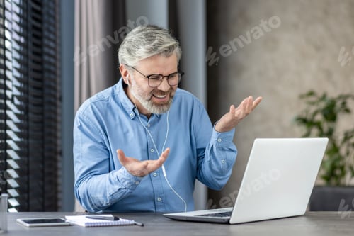 Preview: Excited Man Video Conferencing From His Desk