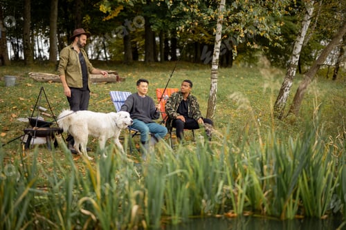 Preview: Pleased male friends resting and fishing in nature
