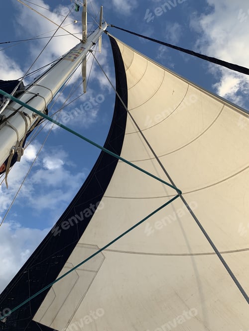 Preview: Vertical shot of a large full sail on a sailing yacht off the coast of Maui, Hawaii
