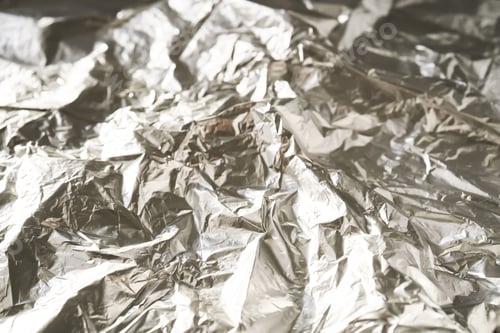 Preview: Abstract background made of crumpled silver foil.